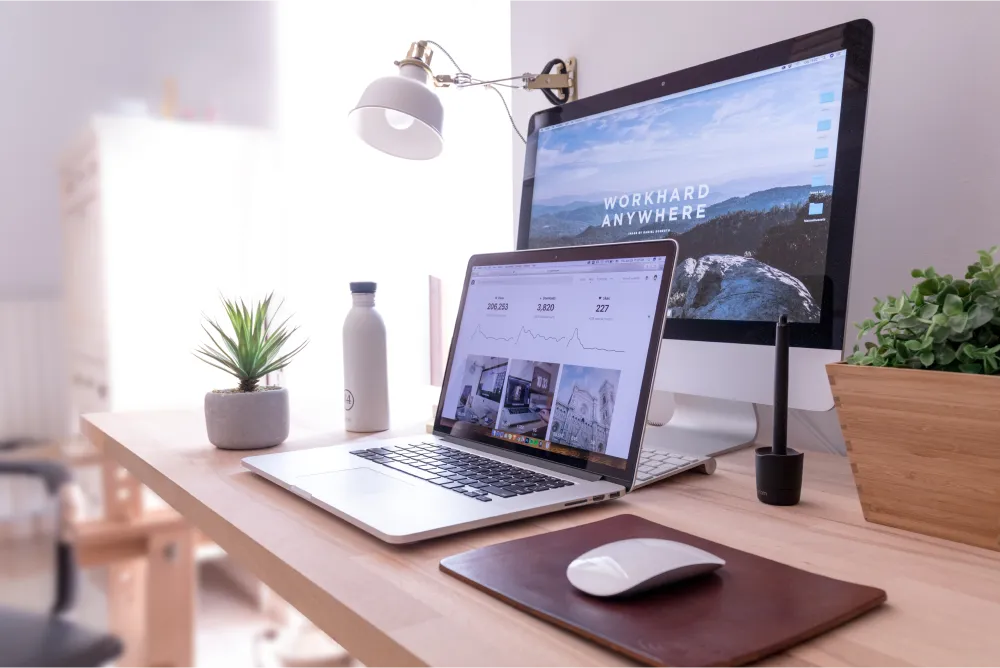 Photo of a laptop and monitor set up at a home office